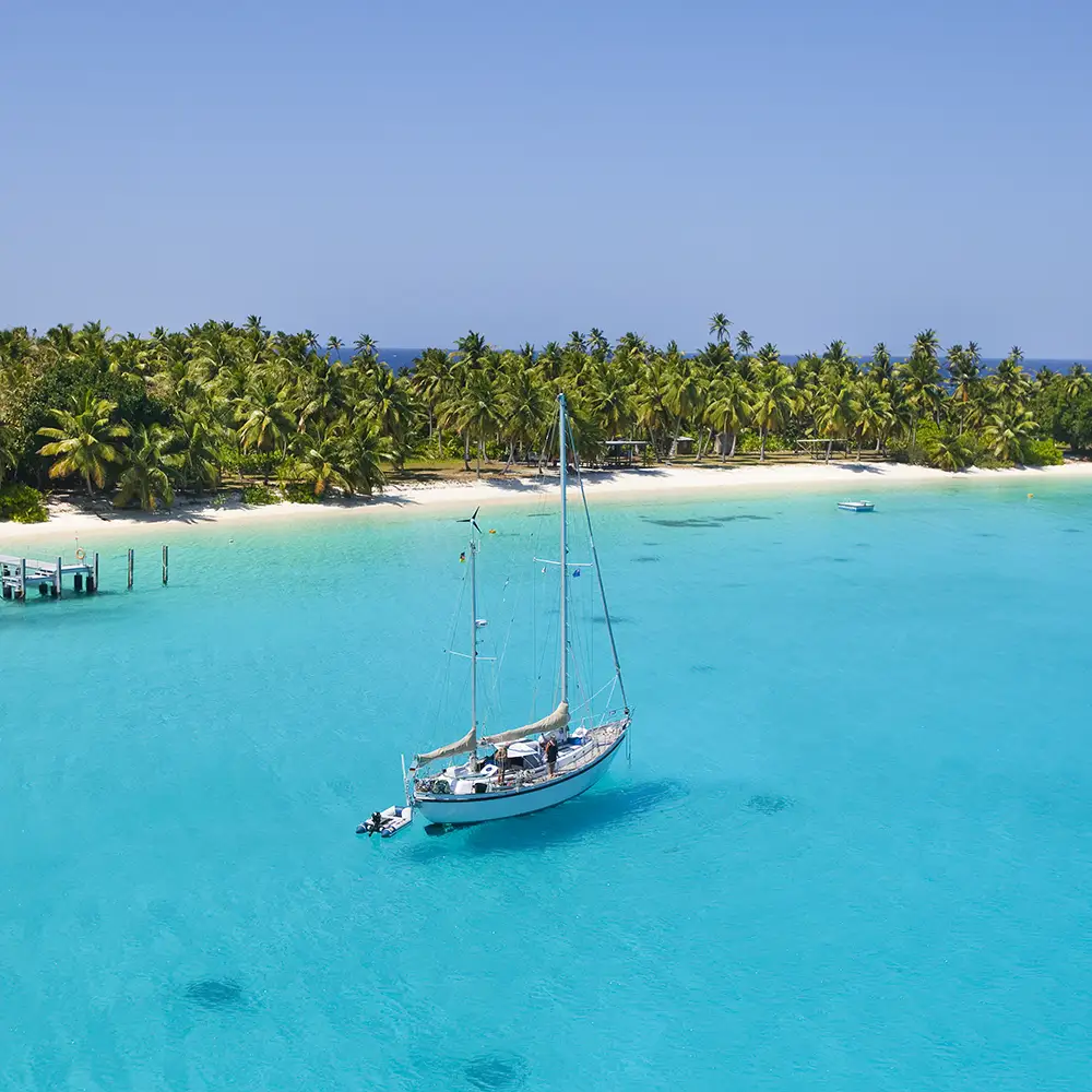 yacht anchored off beach