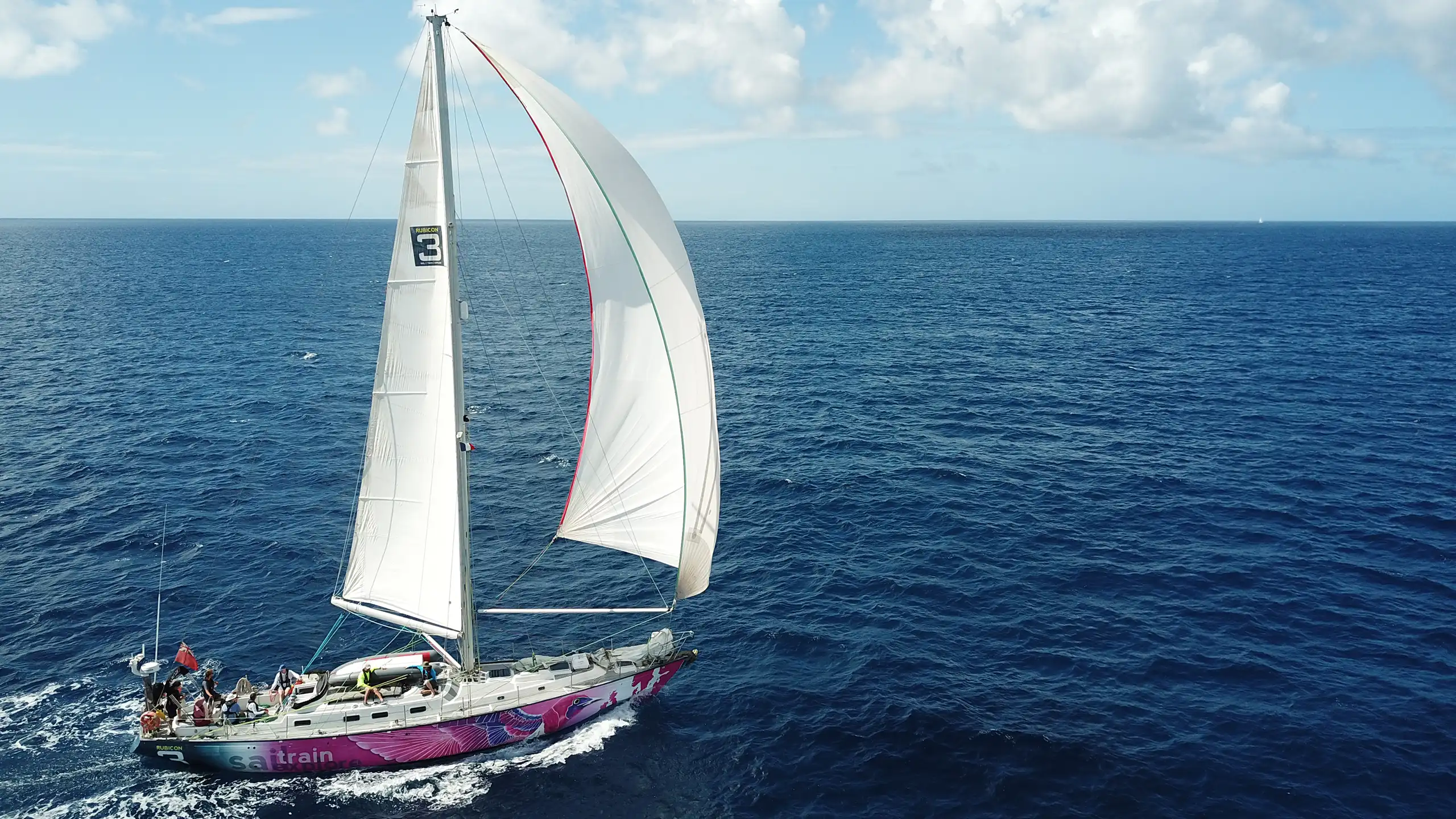 yacht under spinnaker on ocean