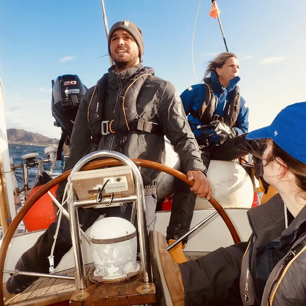 Crew smiling at sea