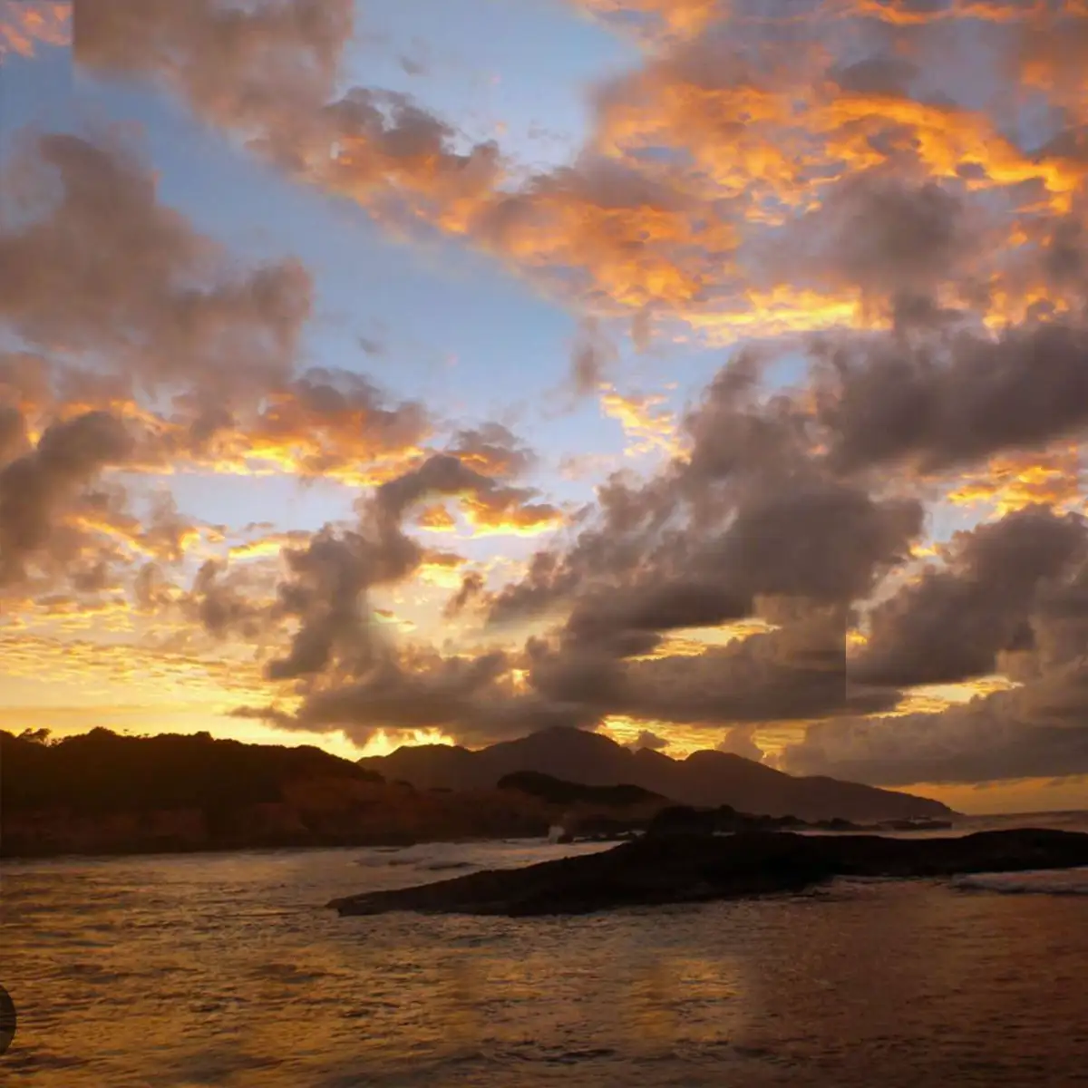 caribbean islands from the sea at sunset