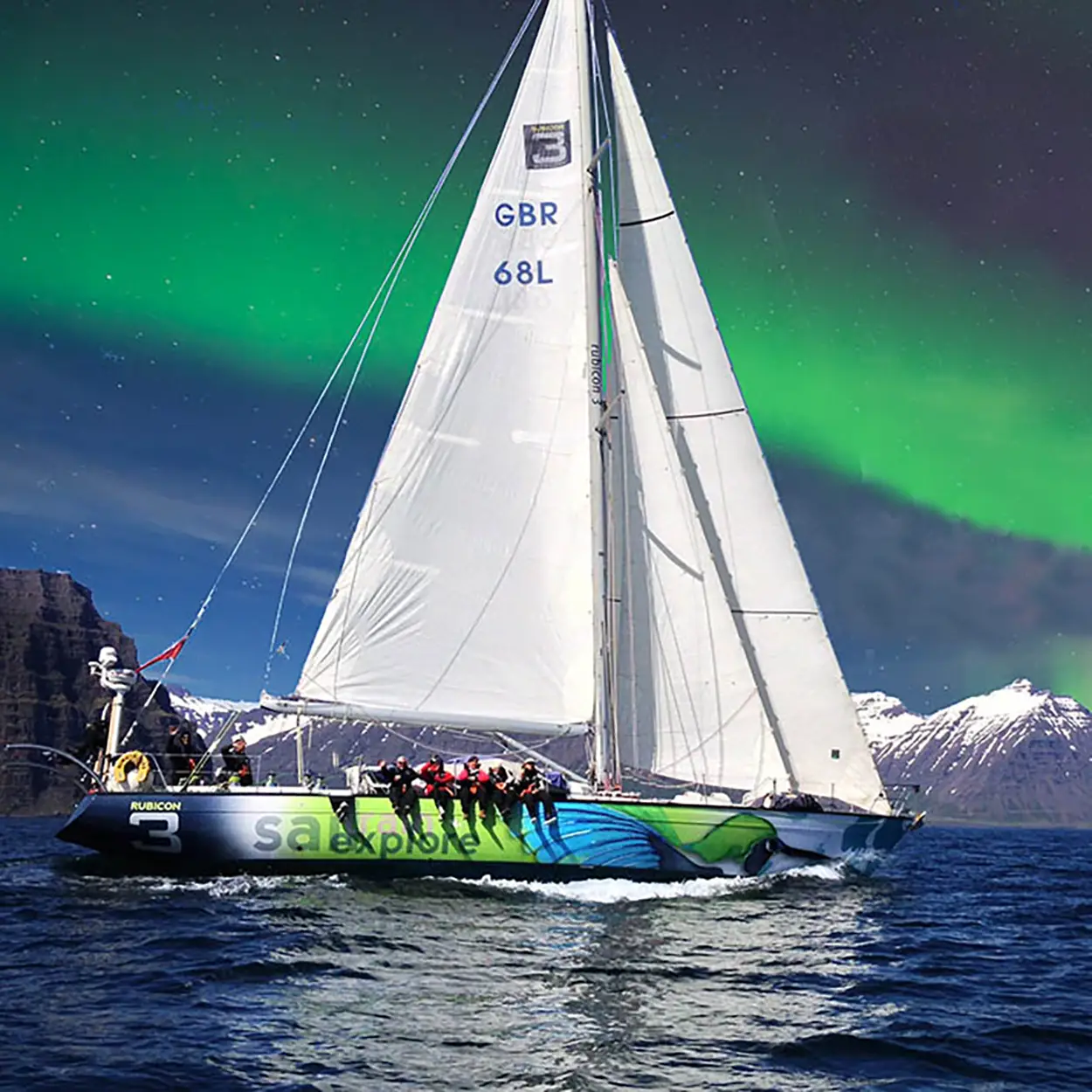 yacht sailing under northern lights