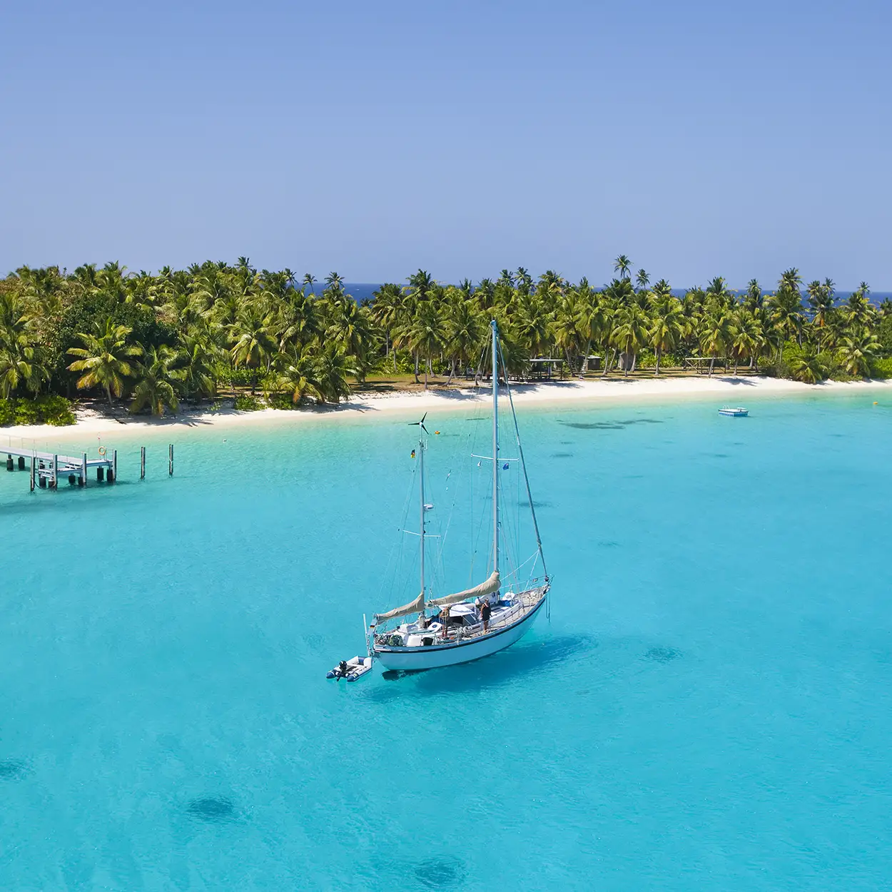 yacht anchored in caribbean off beach